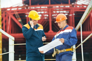 bigstock-two-engineer-builders-with-blu-33843896-e1539112282656.jpg